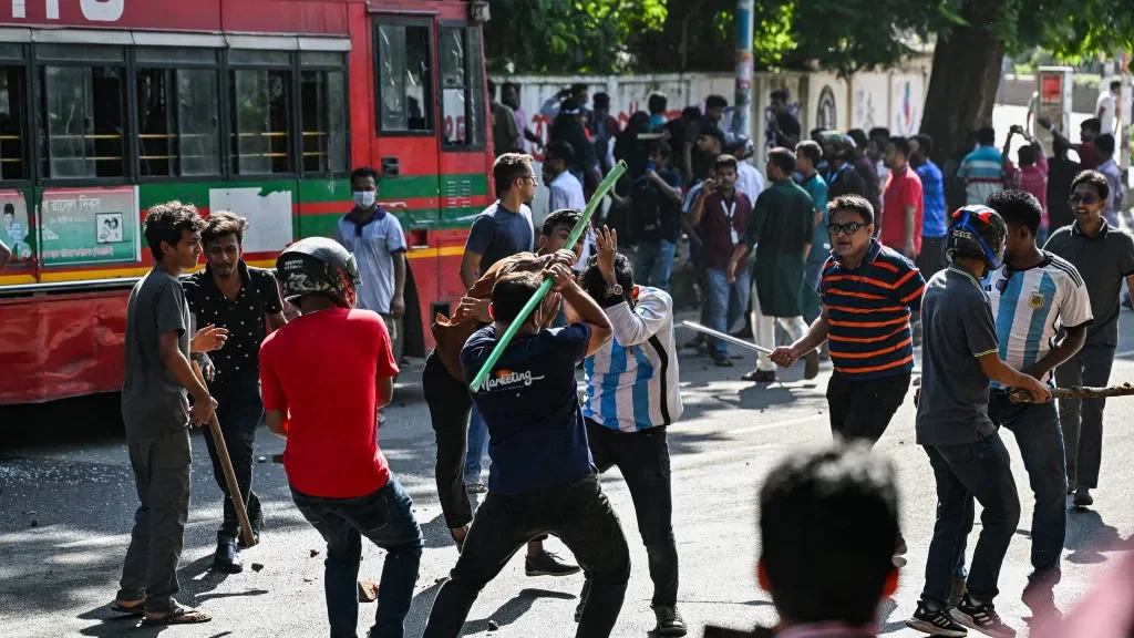 Image showing protesters beating people 